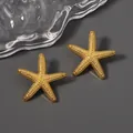 Golden starfish stud earrings with detailed bead texture on a minimalist background - Gold