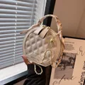 White quilted circular bag with silk scarf handle and golden chain strap for women - Off-white