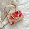 Pink and orange tie-dye square box clutch bag with pearl handle and gold chain strap - Red