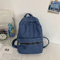 Dark blue denim backpack with vintage wash, zipper closure and front utility pocket - Dark Blue