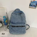Vintage light blue washed denim backpack with adjustable straps and front pocket - Light Blue