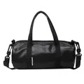 Sleek black glossy pillow cylinder handbag with detachable crossbody strap and top handles - Black