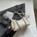 Chic creamy white underarm bag with glossy crinkle texture and silver chain strap - Off White