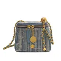 Blue denim striped bucket bag with gold chain strap and floral charm accessory - Dark Blue