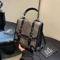 Sac à dos vintage en toile gris foncé avec sangles en cuir noir et boucles en métal - café