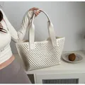 Minimalist beige laser-cut tote bag with hollow circular design and wide handles - Yellow