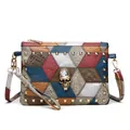 Detail of multi-color patchwork leather bag with gold rivets and skull ornament - Color Block