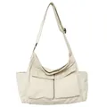 Versatile large canvas messenger bag in off-white with adjustable straps and dual front pockets - Off White