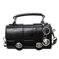 Black glossy barrel messenger bag with dual silver turn-locks and metallic ball charm - Black