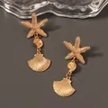 Chic gold starfish and seashell drop earrings for a stylish beach vacation look - Gold Starfish Snail Shell Pendant Earrings