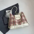 Minimalist checkered tote bag with a beige bow detail and leather trim accents - Off White