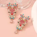 Detail of reindeer stud earrings with colorful rhinestones and pink teardrop charm - Colorful