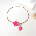 Detail of pink alloy flower pendants on a gold snake chain with a round OT buckle - Necklace / Rose Red