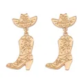 Detailed close-up of gold cowboy hat and boot earrings with intricate scroll patterns - Gold