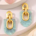 Modern geometric earrings with gold arch and light blue marble resin pendants - Cyan Arch