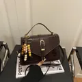 Deep brown croc-effect shoulder bag with golden buckle and creative beaded charm strap - With Pendant / Coffee