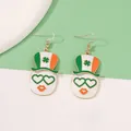 Detailed view of Saint Patrick's Day face earrings with green shamrock hat and heart glasses - White Heart Eyes