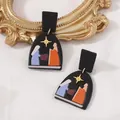Ethnic polymer clay geometric arch earrings featuring colorful nativity scene patterns - Patterned