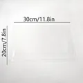 Vista detallada de placa acrílica transparente de 30x20cm con líneas de medida - Bolsas de Embalaje Medianas