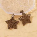 Star-shaped laser-cut wooden drop earrings with double-layered hollow pattern and gold hooks - Camel