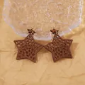 Retro hollow star-shaped wooden earrings with leopard pattern on brown wood - Brown
