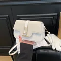 Minimalist woven saddle bag in creamy white and beige with golden metal clasp - White