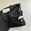 Minimalist black crossbody tote bag with Tidal Dryness print and plush cloud charm - With Pendant / Black