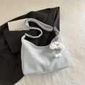 Light blue faux leather dumpling tote bag with adjustable strap and cloud plush charm - With Pendant / Blue