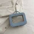 Trousse de maquillage bleu clair avec fenêtre transparente et poignée solide - Bleu