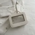 Portable white cosmetic bag with cross-grain texture and transparent PVC window - Off White