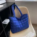 Royal blue quilted tote bag with a soft down-like puffer texture and square stitching - Blue