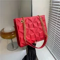 Red textured crossbody bag with 3D geometric pattern and gold chain strap - Red