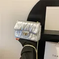 Elegant silver quilted crossbody bag with metallic finish and gold chain strap - Silver