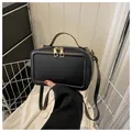 Classic black rectangular handbag with gold zippers and FASHION&BAG embossed design - Black