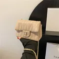 Elegant beige quilted chain shoulder bag with wave texture and gold twist-lock - Khaki