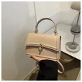 Fashionable beige crossbody bag for women with gold round lock and smooth leather finish - Khaki