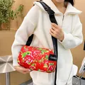 Quilted cylindrical crossbody bag with red floral pattern and adjustable wide strap - Small Flower