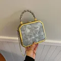 Silver octagonal hard shell evening bag with gold chain strap and metal handle - Silver
