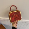 Elegant red marble texture box bag with gold metal frame and chain shoulder strap - Red