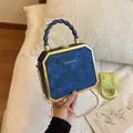 Blue octagonal chain box bag with gold frame and twisted handle for women - Blue