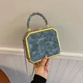 Octagonal gray-blue textured faux leather crossbody bag with gold chain and spiral handle - Gray
