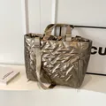Quilted champagne gold metallic tote bag with padded texture and adjustable shoulder strap - Gold