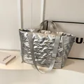 Silver metallic quilted tote bag with padded texture and adjustable wide shoulder strap - Silver