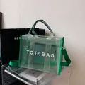 Green semi-transparent mesh tote bag with TOTE BAG print and adjustable shoulder strap - Green