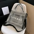 Silver mesh tote bag with white TOTE BAG print and adjustable black shoulder strap - Black