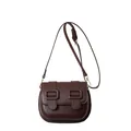 Dark brown matte PU leather crossbody bag with double buckle straps and gold hardware - Brown