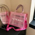 Pink semi-transparent mesh tote bag with TOTE BAG lettering and adjustable strap - Pink