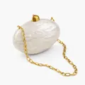 Detail of elegant cream marble acrylic clutch bag with golden metal chain and clasp - Milky White