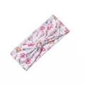 Detail of wide elastic headband featuring colorful cartoon bows and magic wand prints - White