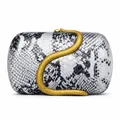 Macro detail of luxury faux python texture and 3D golden snake ornament on clutch bag - Silver